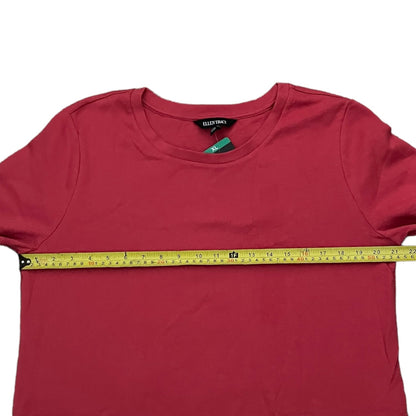 Red t-shirt dress with a measuring tape across it on a white background