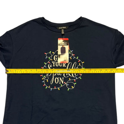 Christmas-themed design shirt and measuring tape, on a white background