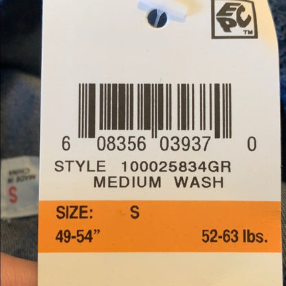 Clothing tag with size and washing information on a blurred background