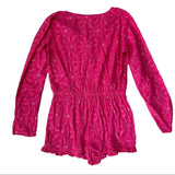 Pink romper with geometric pattern on a white background