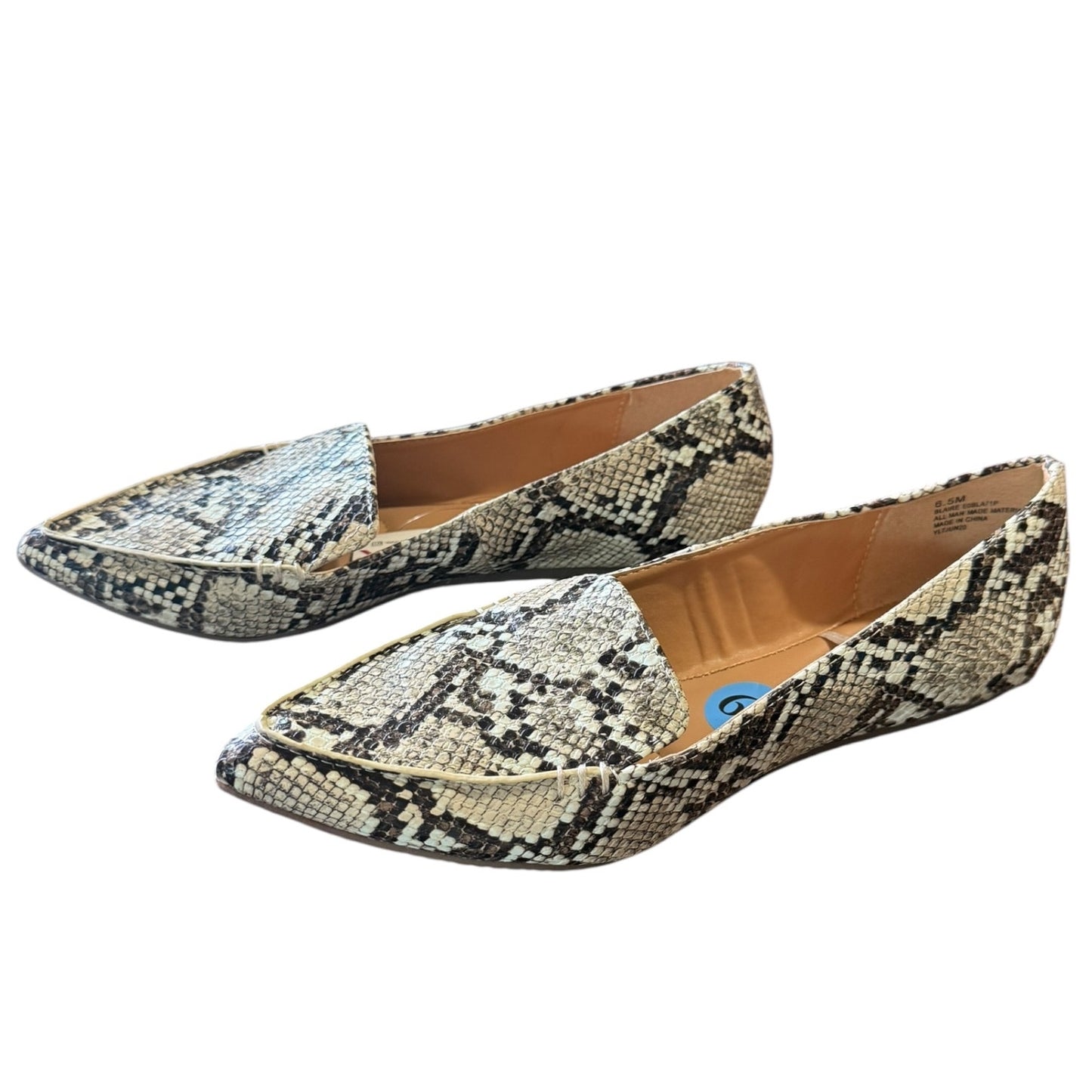 Pair of snake print flats on a white background