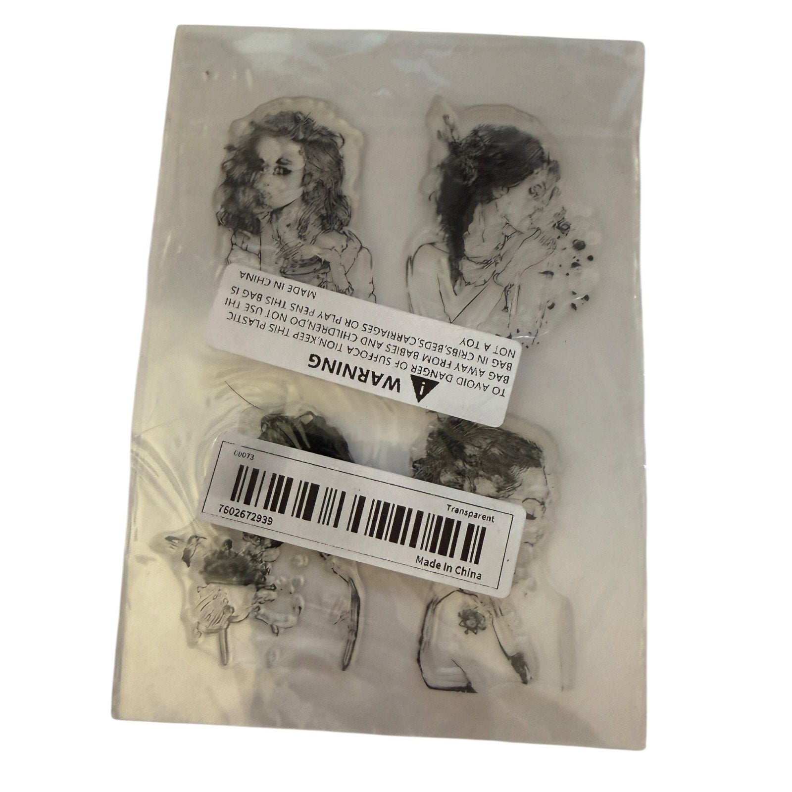 A package of four clear rubber stamps featuring black and white line-art illustrations of women, sealed in a clear plastic bag with product labels and a barcode sticker.