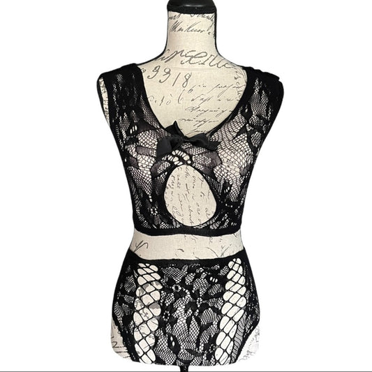 Black lace lingerie set on a mannequin against a white background