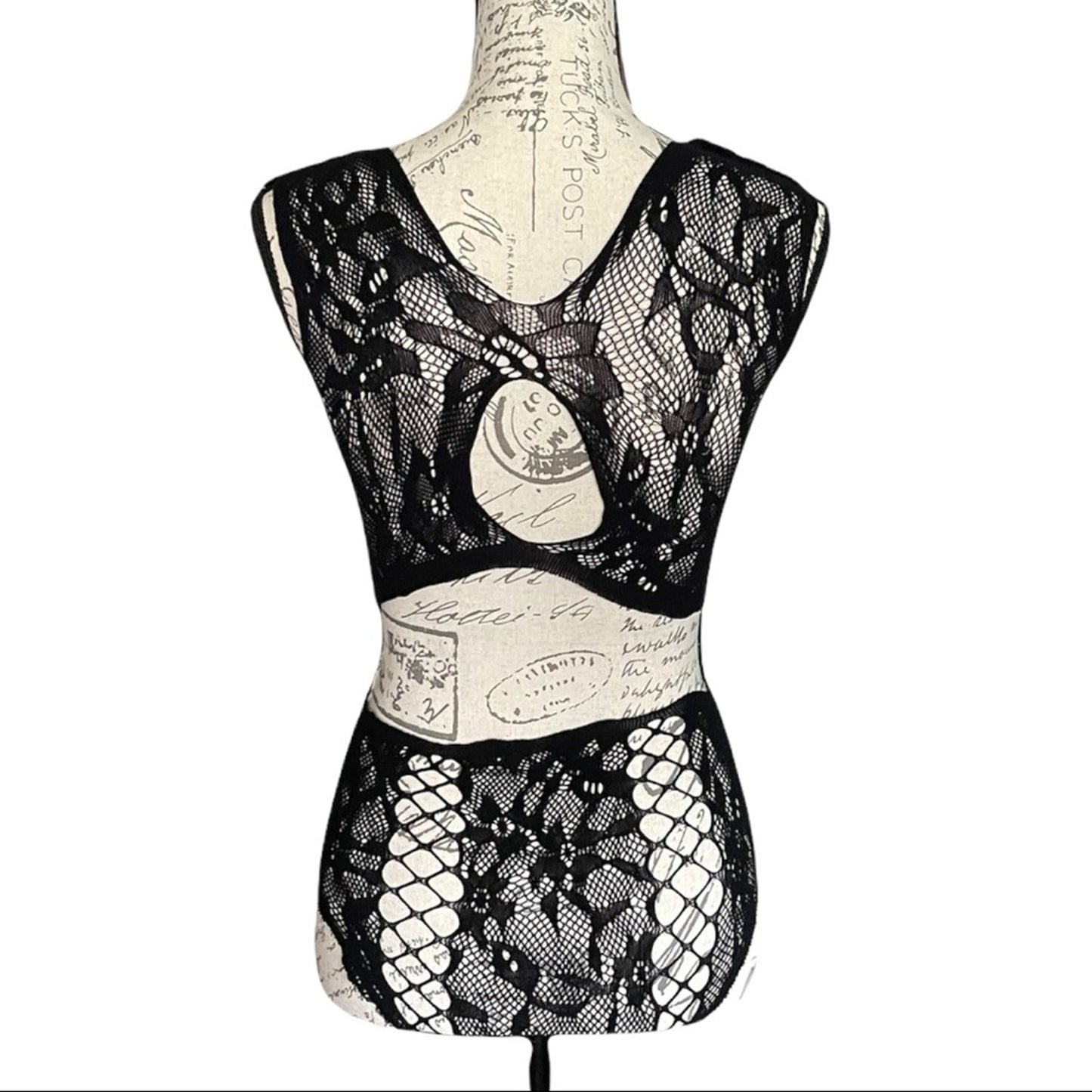 Black lace lingerie set on a mannequin against a white background