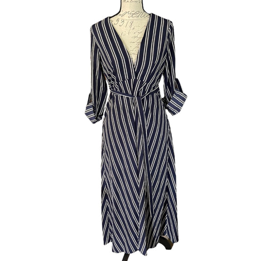A navy blue and white striped wrap dress with three-quarter sleeves and a tie waist, displayed on a mannequin torso against a plain white background.