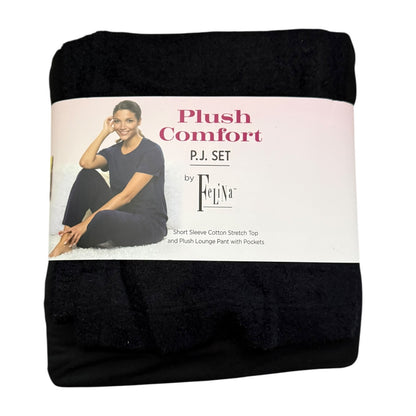 Packaged black pajama set with a model on the label against a white background