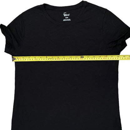 Black t-shirt with a measuring tape across it on a white background