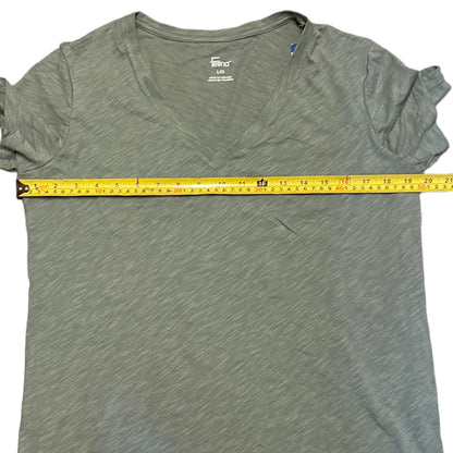 Green t-shirt with a measuring tape on a white background