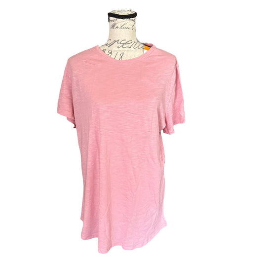 A light pink short-sleeve t-shirt displayed on a vintage-style dress form mannequin against a plain white background.