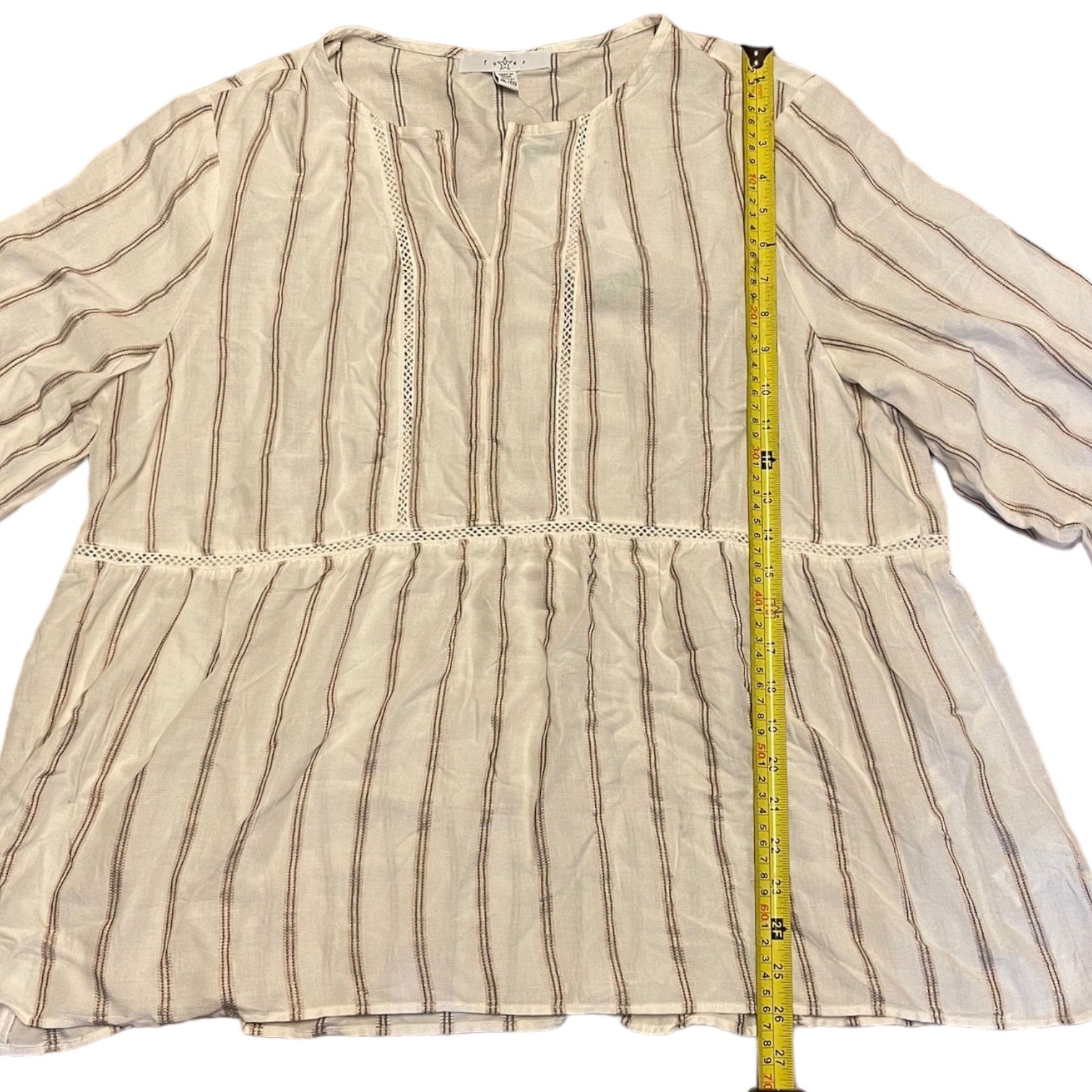 Striped shirt with a measuring tape on a white background