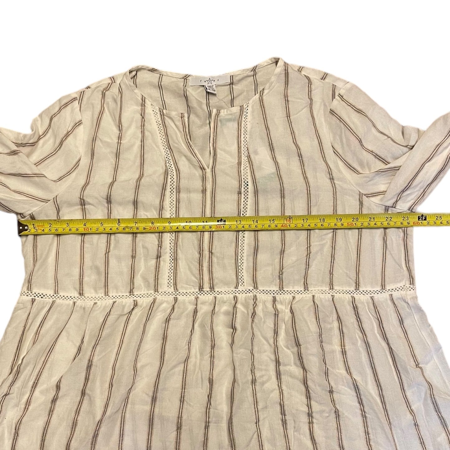 Striped shirt and a measuring tape across it on a white background