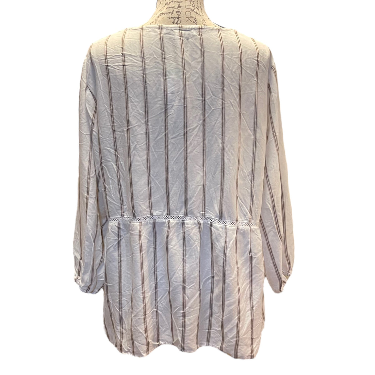 A long-sleeve blouse with vertical stripes, displayed on a mannequin torso against a plain white background.