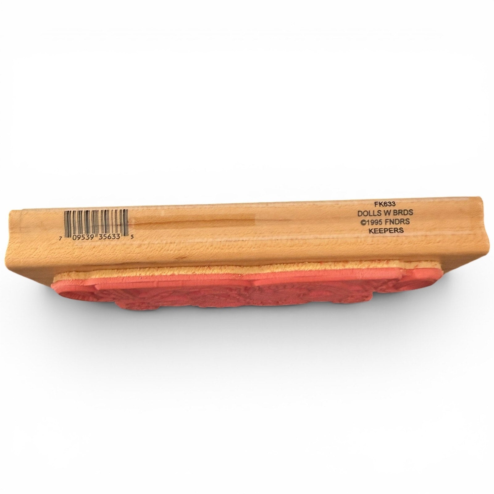 Wooden block with red stamp and visible branding on a white background