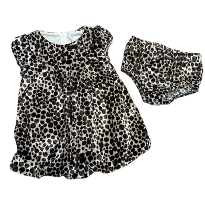 Leopard print baby dress with matching shorts on a white background