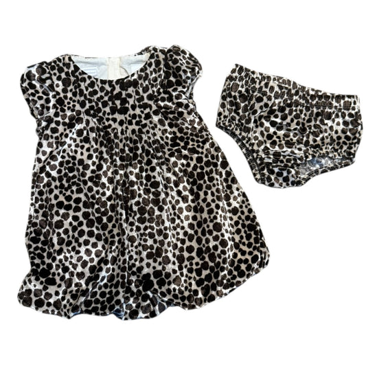 Leopard print baby dress with matching shorts on a white background