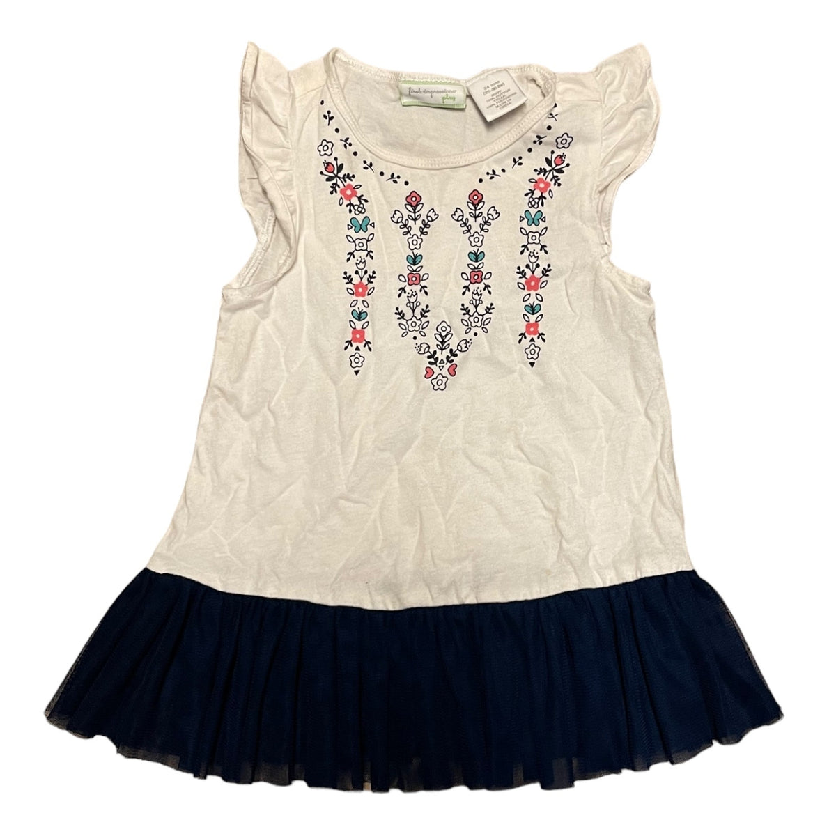 A girls' sleeveless top with ruffled cap sleeves, an white body, and colorful floral around the neckline, finished with a dark navy tulle skirt.