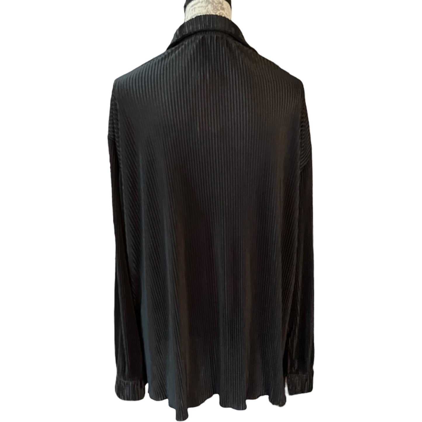 Back of Black ribbed sweater on a mannequin against a white background