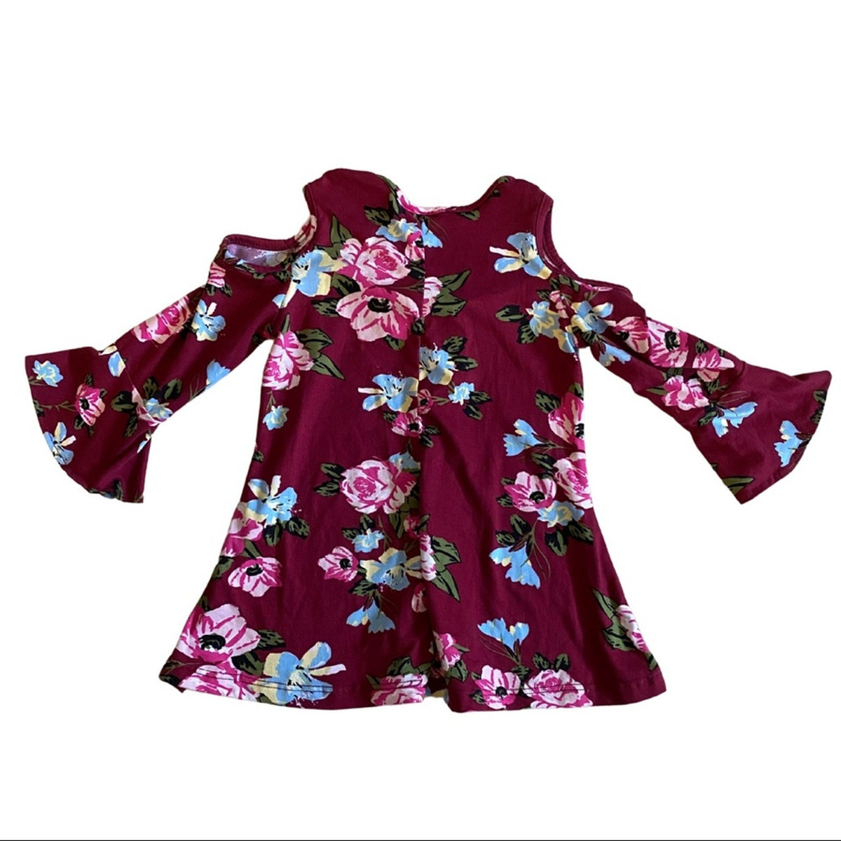 A long-sleeve cold-shoulder top in deep burgundy with a vibrant pink, blue, and green floral print, displayed flat against a white background.
