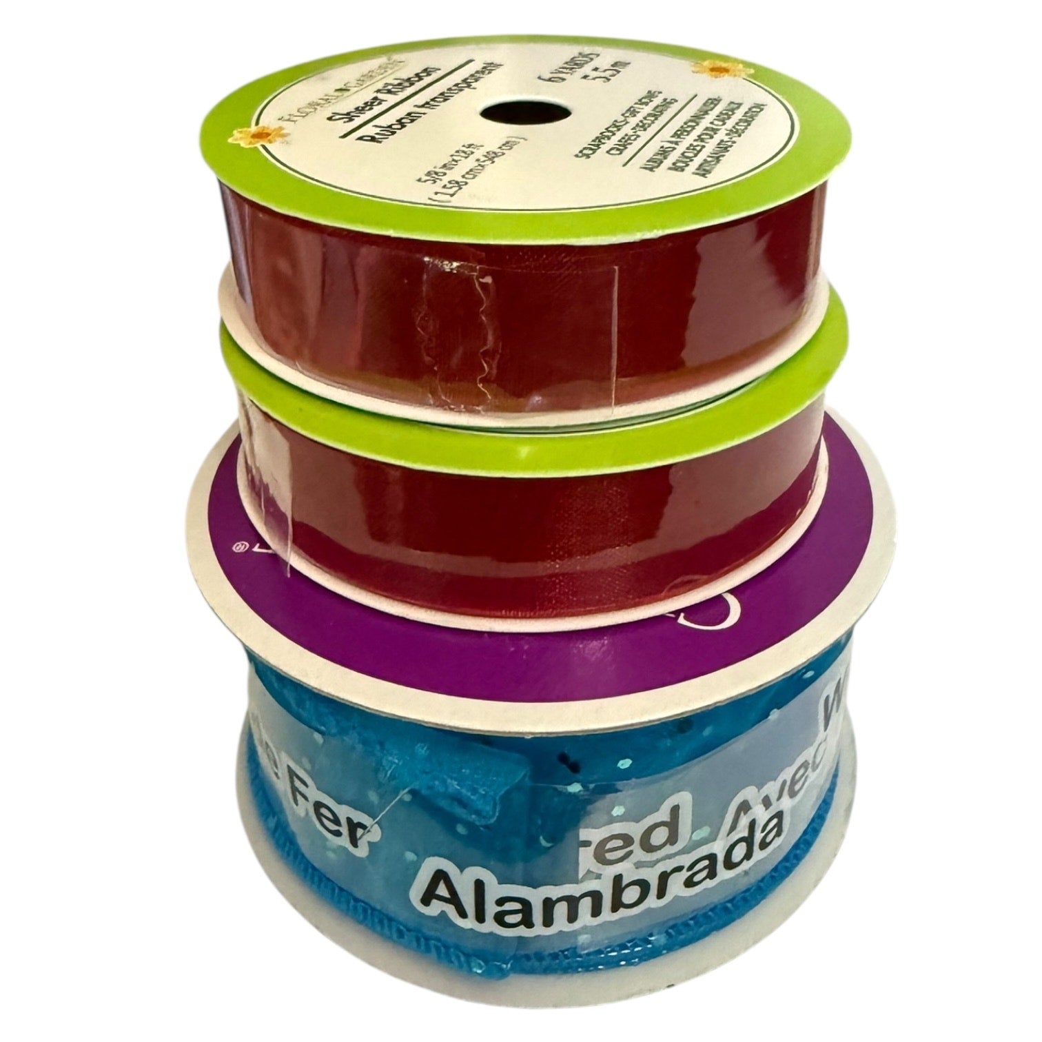 Three stacked spools of ribbon on a white background, showing red velvet ribbon in lime green, red velvet in purple, and light blue satin ribbon with Spanish text.
