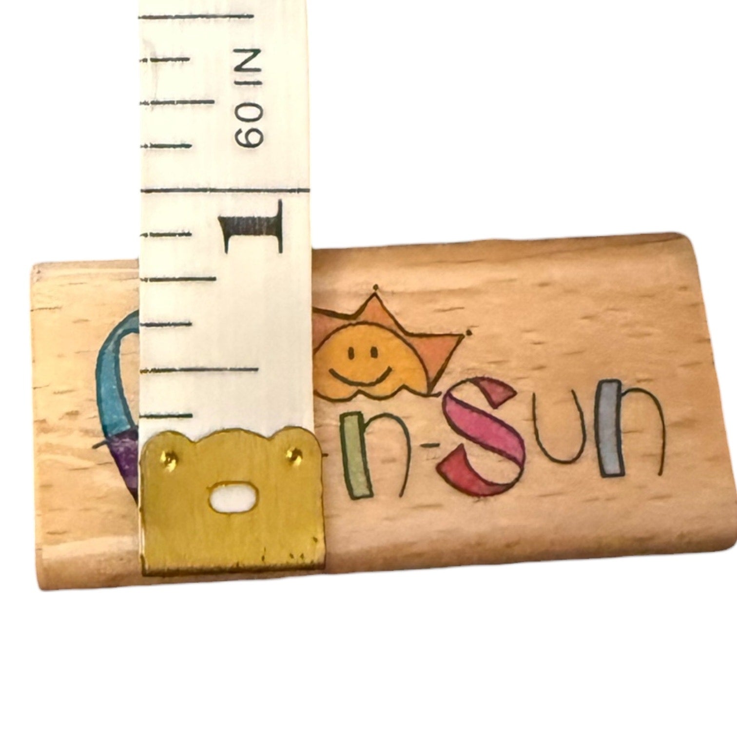 ruler on wood block on a white background