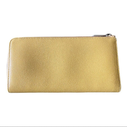A slim, zip-around wallet in textured yellow leather, shown against a plain white background.