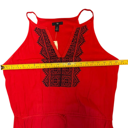 Red dress and a measuring tape on a white background