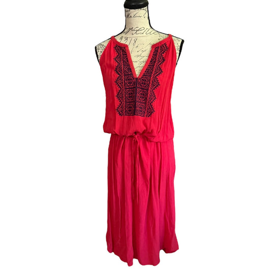 Red dress with blue embroidery on a mannequin against a white background