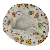 Bottom side of bucket hat with giraffe pattern on a white background