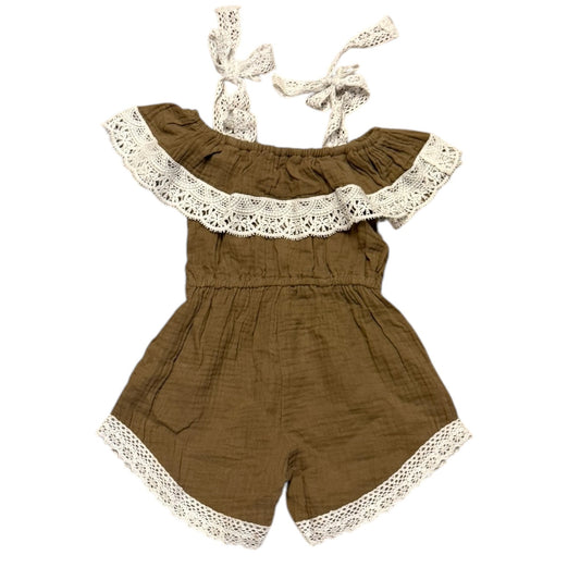 A baby romper in textured brown gauze with off white lace trim and tie-shoulder straps, displayed on a solid white background.