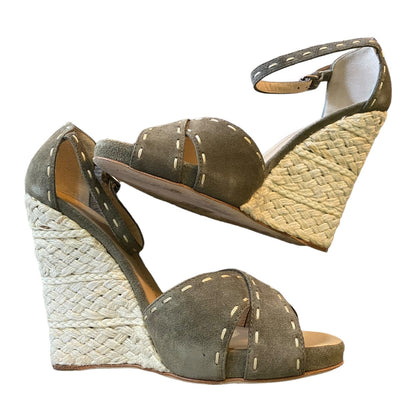 Side view of Green wedge sandals with woven sole on a white background