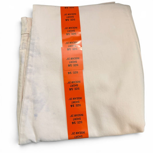 Pink jeans with orange labels on a white background
