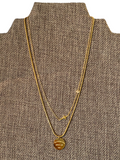 Gold necklace on display