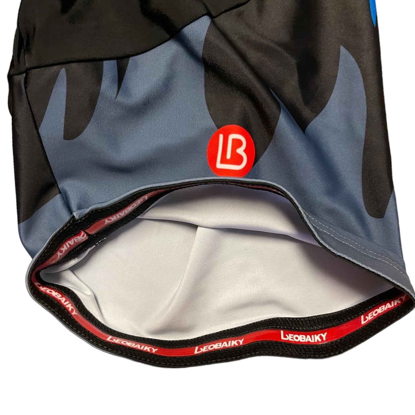 Close-up of a sports outfit with a brand logo on a white background