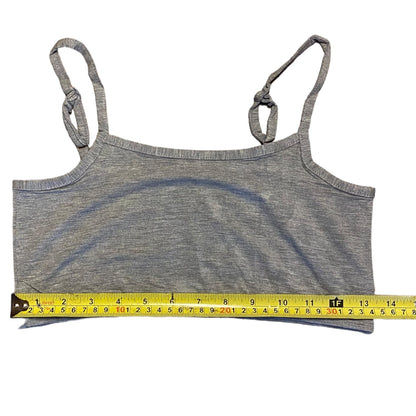 Gray tank top with measuring tape on a white background