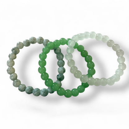 Three beaded bracelets on a white background