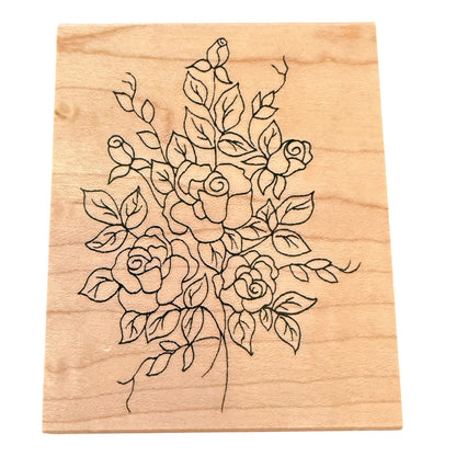 Front of wood block stamp with a rose and vince drawing on a white background. 