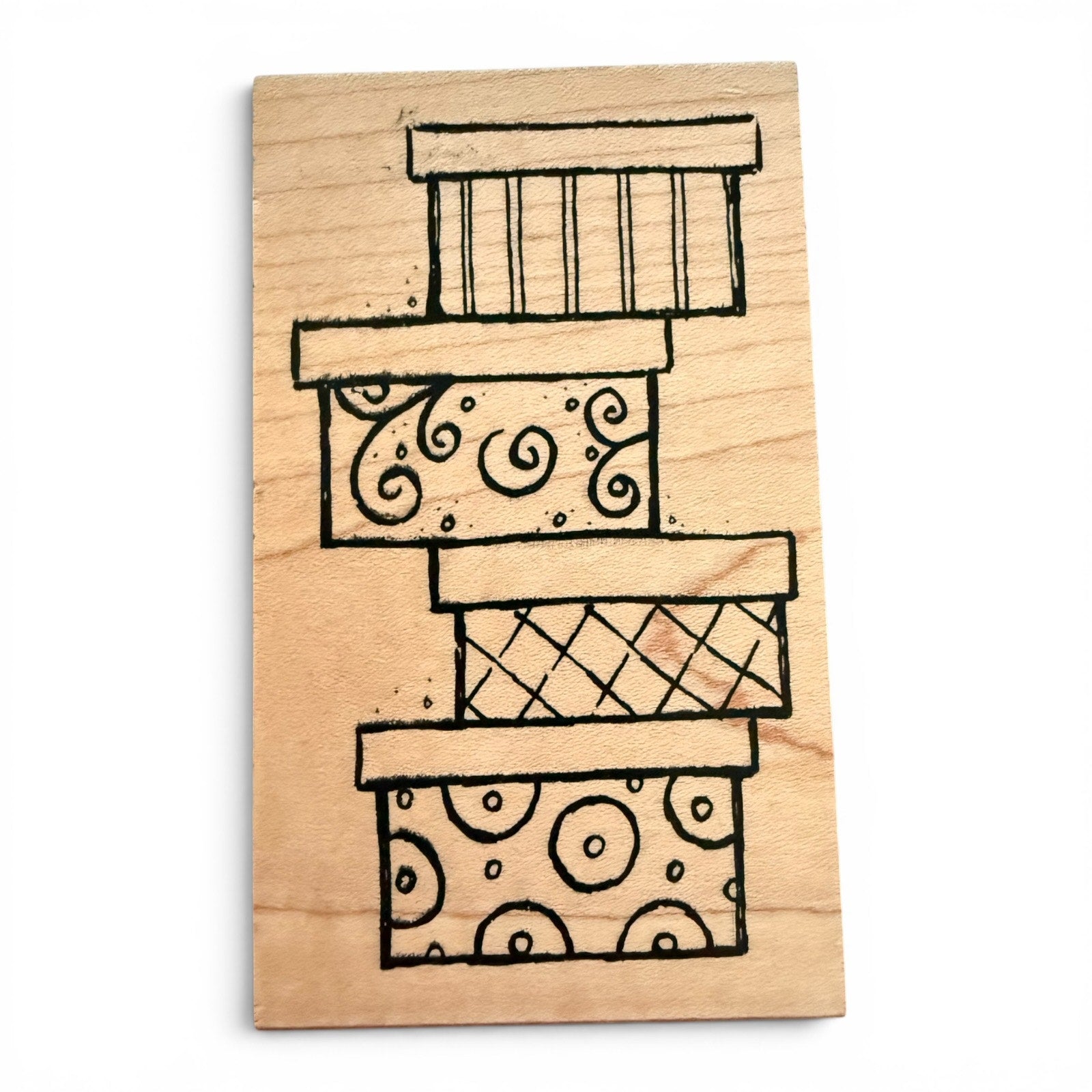 Wooden stamp with decorative patterns on a white background