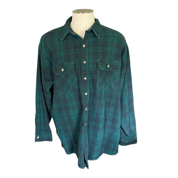 Green plaid shirt on a mannequin against a white background