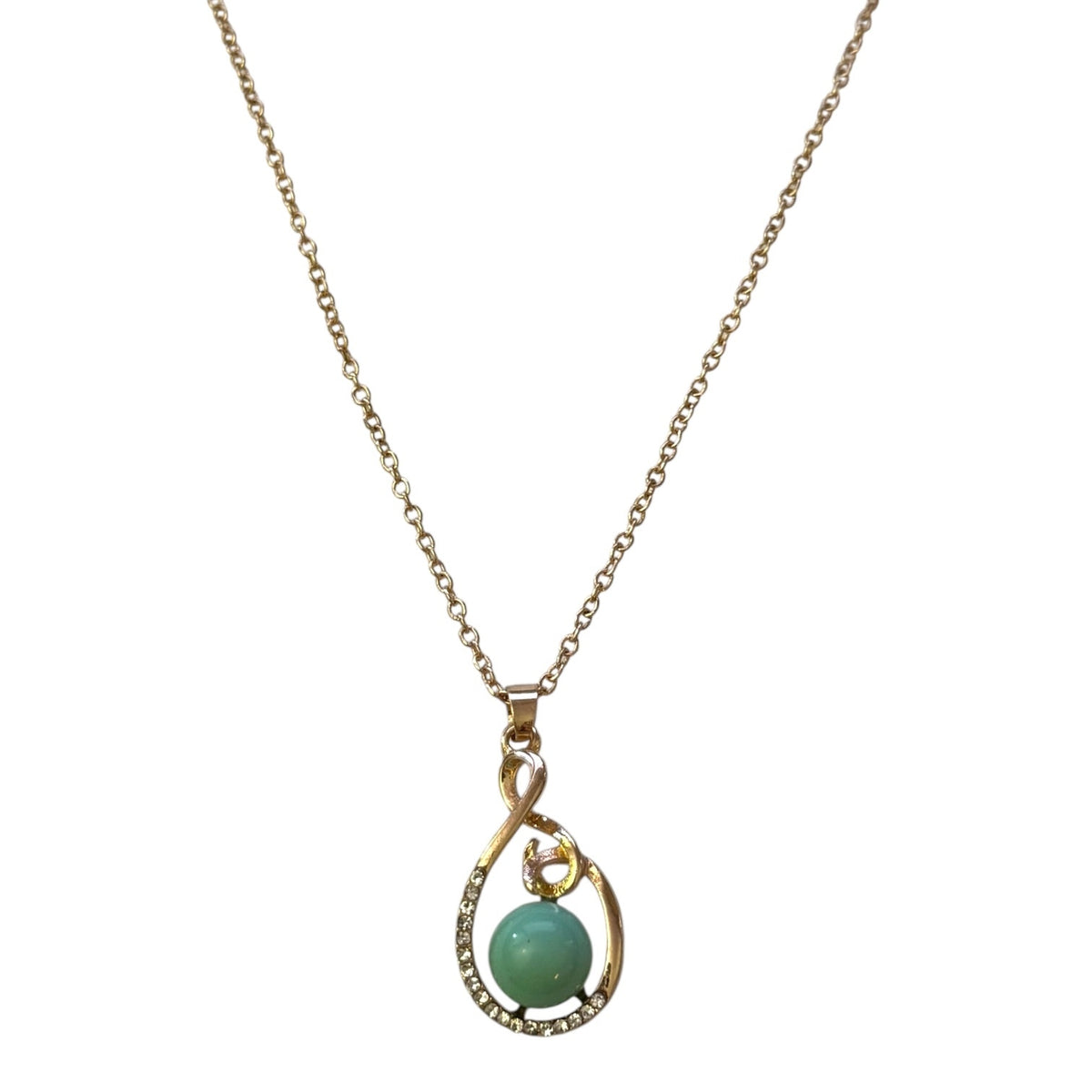 Gold necklace with a green pendant on a white background