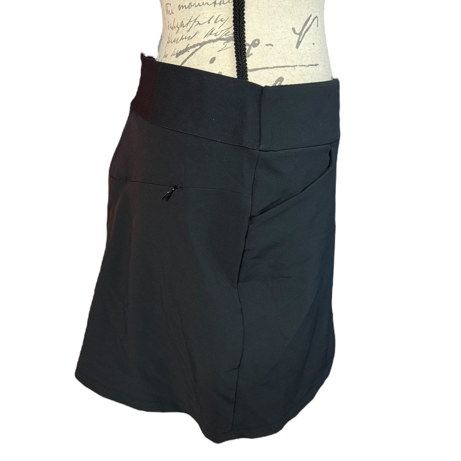 Black skort side view on a mannequin with a white background