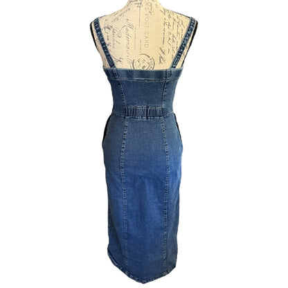 Back of Blue denim dress on a mannequin with a white background