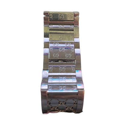 A close-up of a metal watch band with a silver finish, featuring a polished silver-toned center section and a rose gold-toned outer section with engraved 'G' logos.