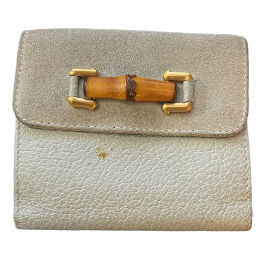 Blue leather wallet with a wooden buckle on a white background