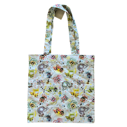 Tote bag with colorful monster pattern on a white background