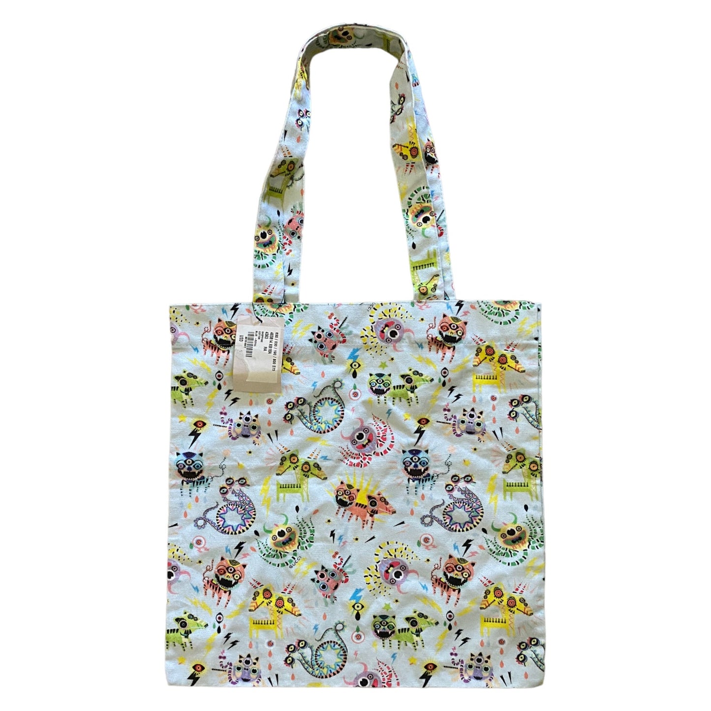 Tote bag with colorful monster pattern on a white background