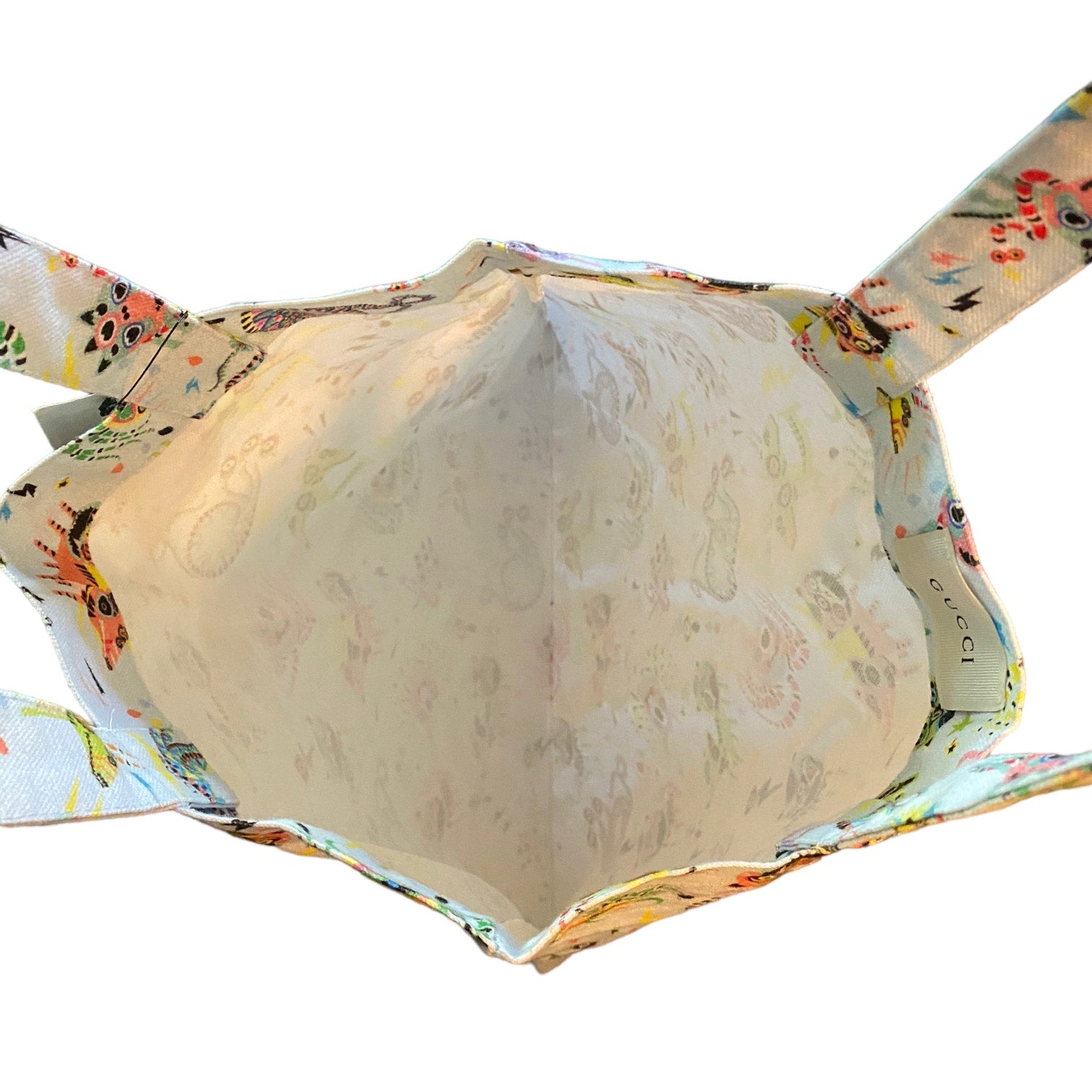 Interior of tote with monster pattern on a white background