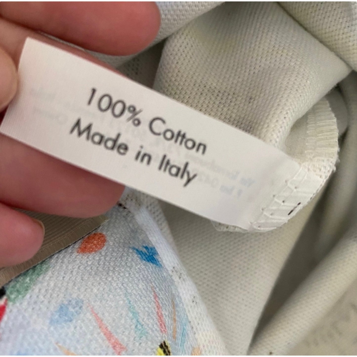 Label on fabric indicating 100% cotton and 'Made in Italy'.
