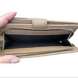 Interior coin pocket of pink wallet