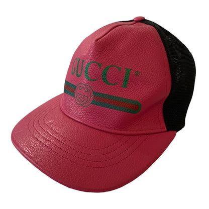 Pink Gucci cap with black backing on a white background