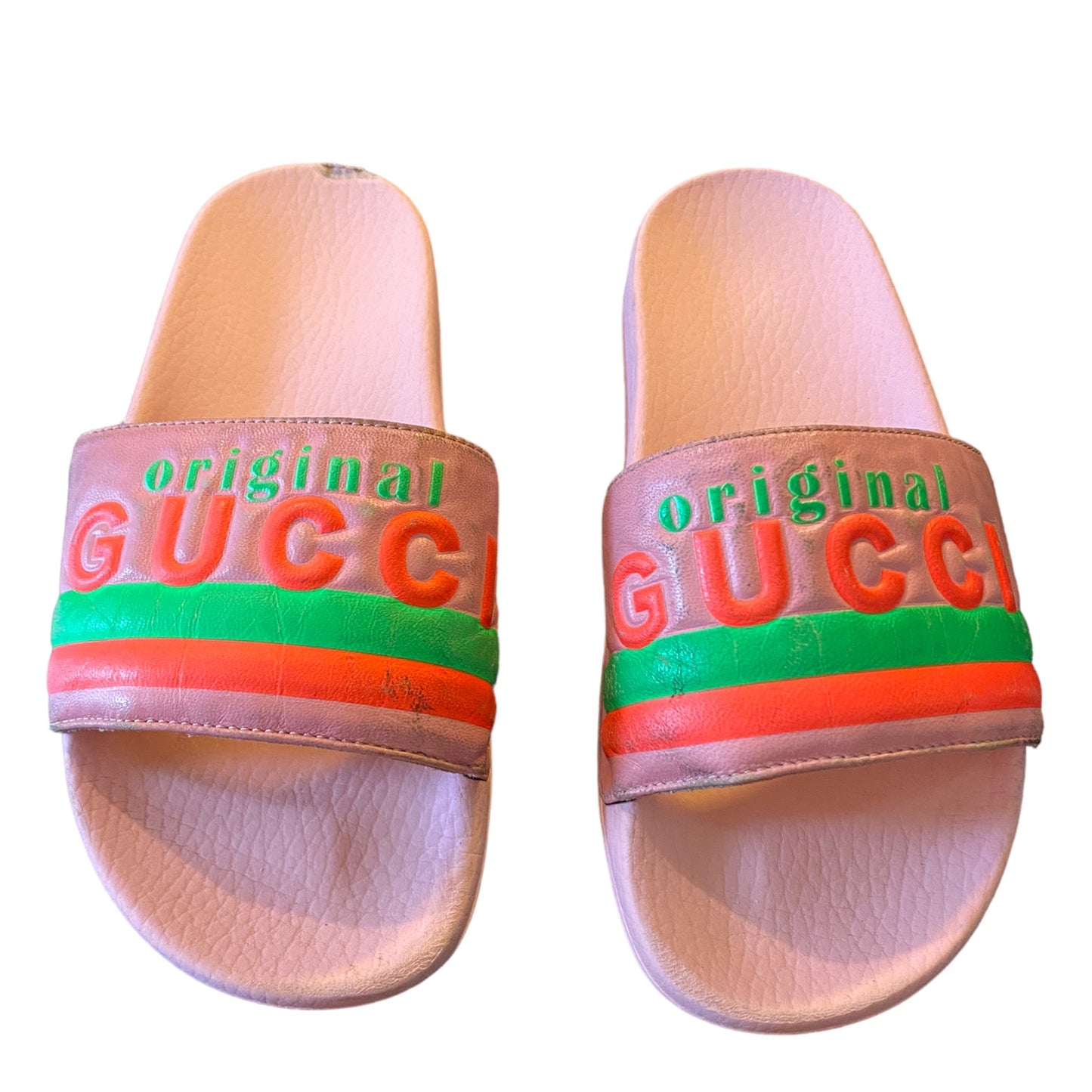 Pair of slides with 'original GUCC' text on a white background